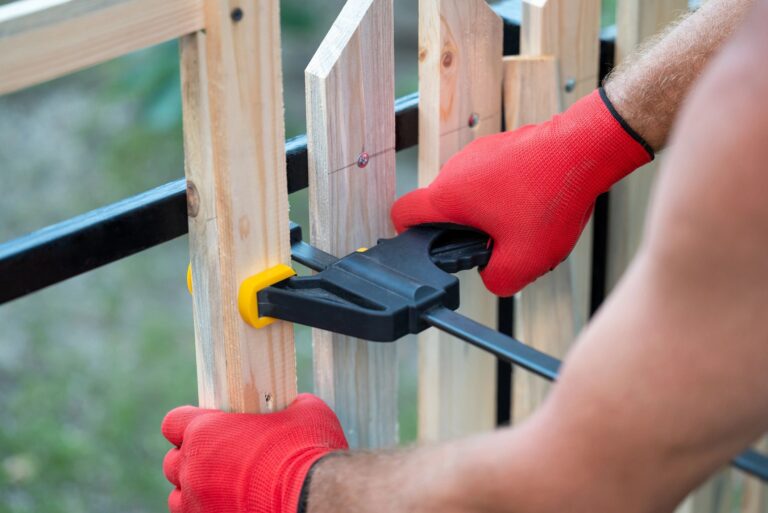 Building wooden fence with metal frame